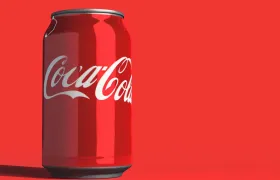 Red Coca-Cola can with white script logo on a red background