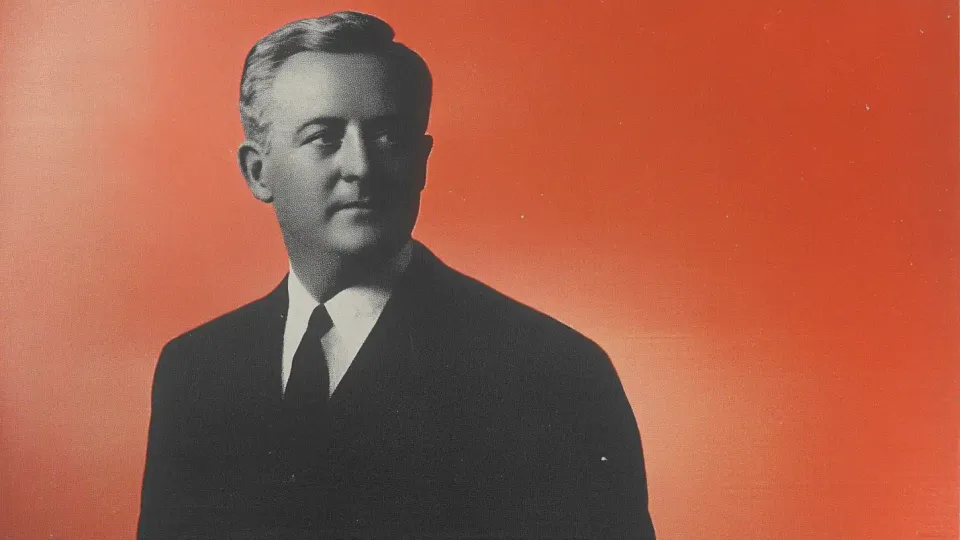 H.B. Reese portrait, halftone black-and-white photo on red background