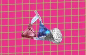 Three Hershey’s Kisses in pink, blue and silver foil wrappers