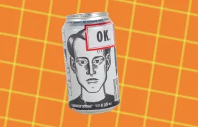 OK Soda can with line-drawn comic face on orange grid background