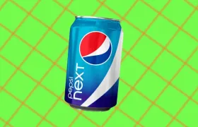 Pepsi Next can on a green grid background