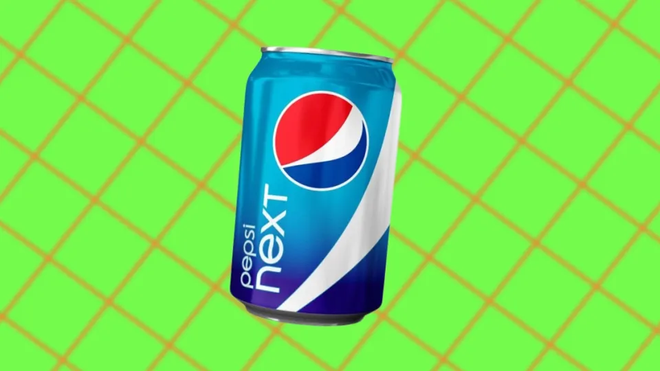 Pepsi Next can on a green grid background