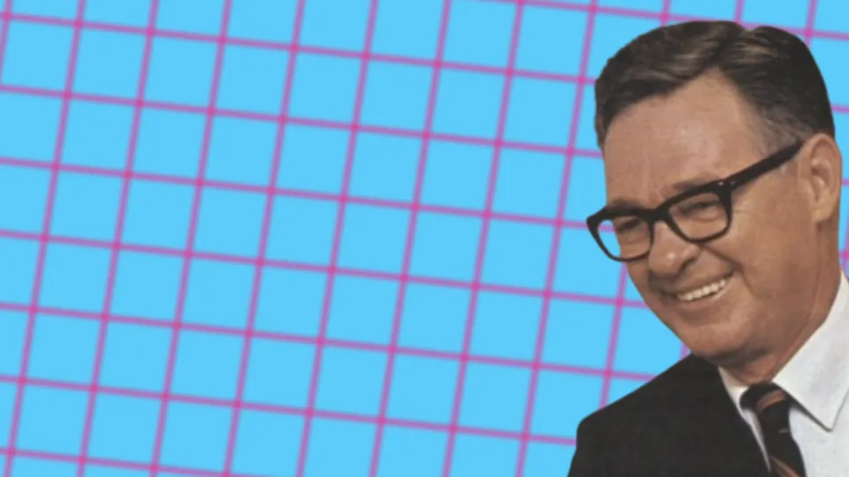 Herman Lay smiling in horn-rimmed glasses and suit on pink grid