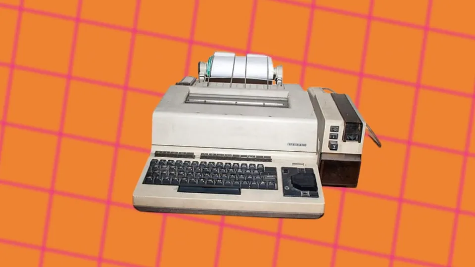Vintage Siemens telex teleprinter machine with keyboard and paper roll