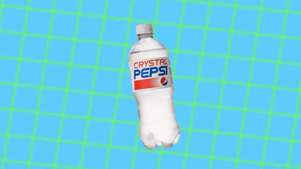 Crystal Pepsi clear cola bottle on blue and green grid background