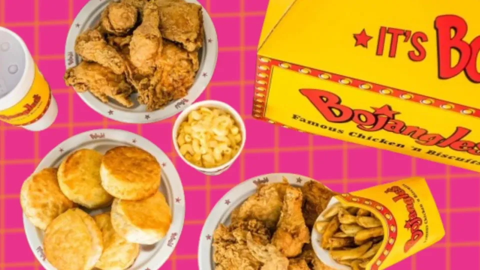 Bojangles fried chicken, biscuits and mac and cheese on pink background