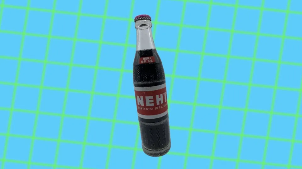 Vintage Nehi soda bottle with red and white paper label