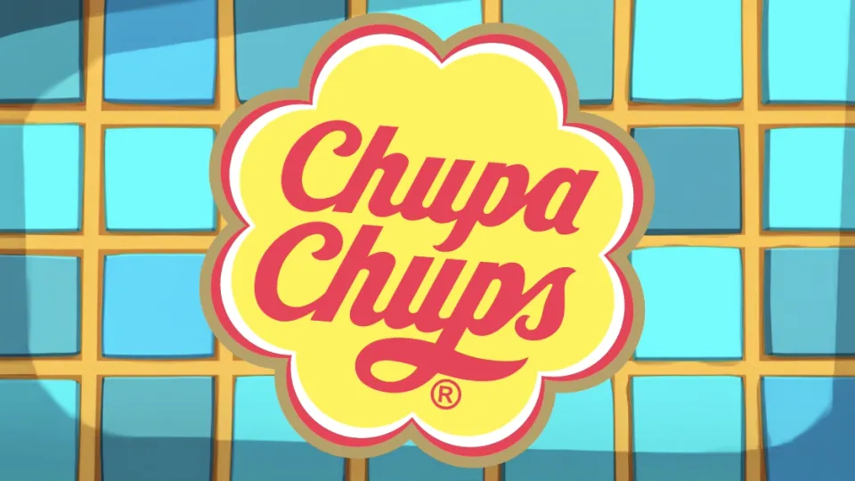 Chupa Chups flower logo in yellow and red on blue tiles