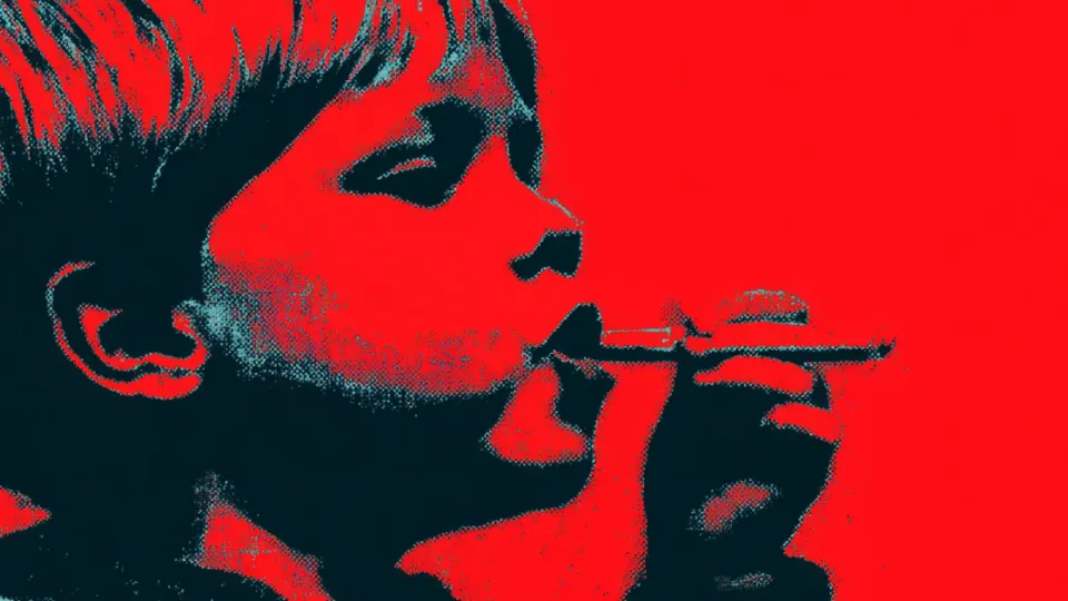Child in profile holding a candy cigarette to their lips