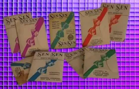 Vintage Sen-Sen breath mint packets from Argentina on purple grid background