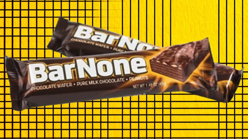 Two BarNone chocolate wafer candy bar wrappers on a yellow grid background