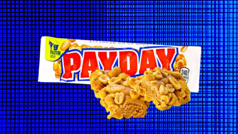 Payday candy bar and wrapper on a blue grid background