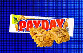 Payday candy bar and wrapper on a blue grid background