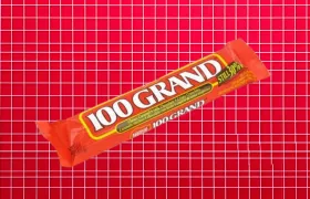 100 Grand candy bar in red wrapper on red grid background